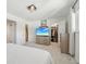 Spacious bedroom with walk-in closet and ensuite bathroom access, featuring modern decor at 12455 W Alameda Dr, Lakewood, CO 80228