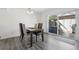 Bright dining area with table and chairs and sliding door to the outdoor patio at 12455 W Alameda Dr, Lakewood, CO 80228