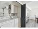 Convenient laundry area with washer, dryer, and built-in shelving for storage at 12455 W Alameda Dr, Lakewood, CO 80228