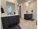 Elegant bathroom with double vanity and plenty of counter space at 15682 W Girard Ave, Morrison, CO 80465