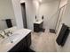 Modern bathroom with double vanity and walk-in shower at 15682 W Girard Ave, Morrison, CO 80465