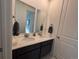 Elegant bathroom featuring double sinks, a large mirror, and granite countertops at 15682 W Girard Ave, Morrison, CO 80465