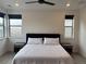 Spacious bedroom with a queen-size bed and mountain views at 15682 W Girard Ave, Morrison, CO 80465