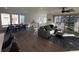 Open concept dining area with hardwood floors and modern table at 15682 W Girard Ave, Morrison, CO 80465