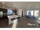 Modern kitchen with large island and stainless steel appliances at 15682 W Girard Ave, Morrison, CO 80465