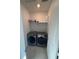 Bright laundry room with washer and dryer at 15682 W Girard Ave, Morrison, CO 80465