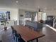 Open concept living room with modern furniture and large windows at 15682 W Girard Ave, Morrison, CO 80465