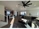 Open concept living area with hardwood floors and modern furniture at 15682 W Girard Ave, Morrison, CO 80465