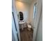 Clean powder room with pedestal sink and modern toilet at 15682 W Girard Ave, Morrison, CO 80465
