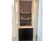 Stylish wet bar with geometric patterned backsplash at 15682 W Girard Ave, Morrison, CO 80465