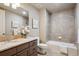 Modern bathroom with a soaking tub and granite countertop at 5592 S Nevada St # 306, Littleton, CO 80120