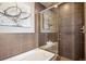 Modern bathroom with a glass shower and soaking tub at 5592 S Nevada St # 306, Littleton, CO 80120