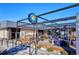 Outdoor patio with seating, fire pit, and modern lighting at 5592 S Nevada St # 306, Littleton, CO 80120