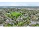 An aerial view of a neighborhood with a park in the distance at 6267 Fenton St, Arvada, CO 80003