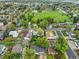 An aerial view of a neighborhood with a park and pond at 6267 Fenton St, Arvada, CO 80003