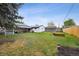 Spacious backyard with a covered patio and detached garage at 6267 Fenton St, Arvada, CO 80003