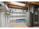 Utility basement with storage shelves and a gas-powered water heater at 6267 Fenton St, Arvada, CO 80003