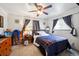 Comfortable bedroom with warm lighting and a ceiling fan, providing a relaxing retreat at 6267 Fenton St, Arvada, CO 80003