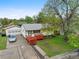 Charming home with a red porch and a detached garage at 6267 Fenton St, Arvada, CO 80003