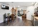 Open kitchen and dining area featuring a breakfast bar and seamless access to the living room at 6267 Fenton St, Arvada, CO 80003
