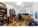 Well-lit office space featuring multiple desks, monitors, and ample shelving for organization and productivity at 6267 Fenton St, Arvada, CO 80003