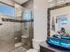 Modern bathroom with a double vanity and a walk-in shower at 2635 Spruce Meadows Dr, Broomfield, CO 80023