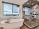 Relaxing bathroom with a large soaking tub and walk-in shower at 2635 Spruce Meadows Dr, Broomfield, CO 80023