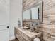 Elegant bathroom with wood-look tile and a modern sink vanity at 2635 Spruce Meadows Dr, Broomfield, CO 80023