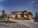 Luxury two-story home with stone accents and landscaped grounds at 2635 Spruce Meadows Dr, Broomfield, CO 80023