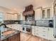 Well-equipped kitchen with a copper range hood and professional-grade range at 2635 Spruce Meadows Dr, Broomfield, CO 80023