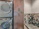 Laundry room with washer, dryer, and dog wash station at 2635 Spruce Meadows Dr, Broomfield, CO 80023