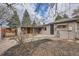 Backyard with a covered patio, seating, and a shed at 1201 Moline St, Aurora, CO 80010