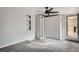 Carpeted bedroom with closet, mirror door, and window at 1201 Moline St, Aurora, CO 80010