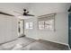 Bedroom featuring a ceiling fan, carpet, windows, and a double-door closet at 1201 Moline St, Aurora, CO 80010