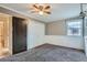 Bedroom featuring carpeted floors, neutral walls, a ceiling fan, and large closet for ample storage at 1201 Moline St, Aurora, CO 80010