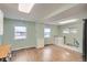 Eat-in kitchen with wood-look flooring, natural wood countertops, and a bright airy feel at 1201 Moline St, Aurora, CO 80010