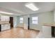 Bright kitchen and dining area featuring wood-look floors, updated counters, and neutral color palette at 1201 Moline St, Aurora, CO 80010