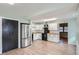 Stylish kitchen with stainless steel refrigerator, white cabinets, and black appliances at 1201 Moline St, Aurora, CO 80010