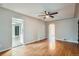 Light-filled living room showing hardwood floors and open doorway at 1201 Moline St, Aurora, CO 80010