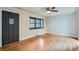 Bright living room with hardwood floors, ceiling fan, and a decorative bay window at 1201 Moline St, Aurora, CO 80010