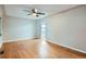 Spacious living room features hardwood floors, a ceiling fan, and neutral walls at 1201 Moline St, Aurora, CO 80010