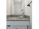 Stylish bathroom with vessel sink, mosaic tile countertop, and modern fixtures at 8737 Santa Fe Dr, Thornton, CO 80260