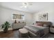 Inviting bedroom featuring hardwood floors and a comfy bed at 8737 Santa Fe Dr, Thornton, CO 80260