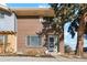 Brick two-story home with a well maintained front yard at 8737 Santa Fe Dr, Thornton, CO 80260