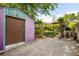 Spacious backyard area with garden plots, brick oven, and storage shed at 178 W Cedar Ave, Denver, CO 80223