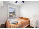 Cozy bedroom with ceiling fan and window at 178 W Cedar Ave, Denver, CO 80223
