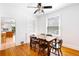 Bright dining room featuring hardwood floors, a ceiling fan, and natural light at 178 W Cedar Ave, Denver, CO 80223