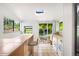 Bright laundry room with washer, dryer and view to a patio at 178 W Cedar Ave, Denver, CO 80223