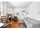 Bright living room with hardwood floors, a fireplace, and comfortable seating at 178 W Cedar Ave, Denver, CO 80223
