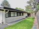 Landscaped backyard with a retaining wall and modern fence at 3069 S Detroit Way, Denver, CO 80210